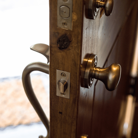 Half Opened Entry Door to House showing door knob and lock components. Residential Locksmith Service - San Antonio, TX - The Key Man Locksmith